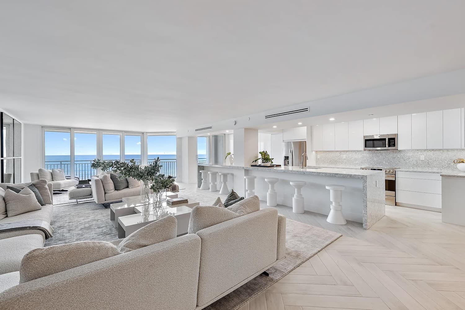 Luxury oceanfront condo renovation with open living and kitchen